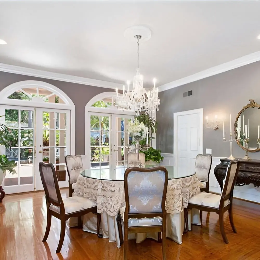 Dining room with a round table and chandelier at Safe Haven Recovery