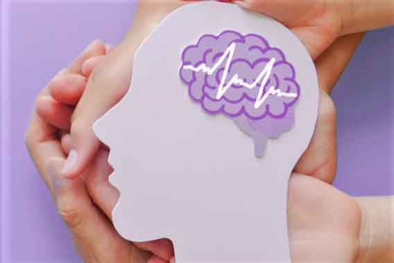 hands hold the outline of a paper human head with a brain colorized to illustrate mental health and dual diagnosis care