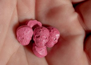 Ecstasy tablet in the palm of a hand