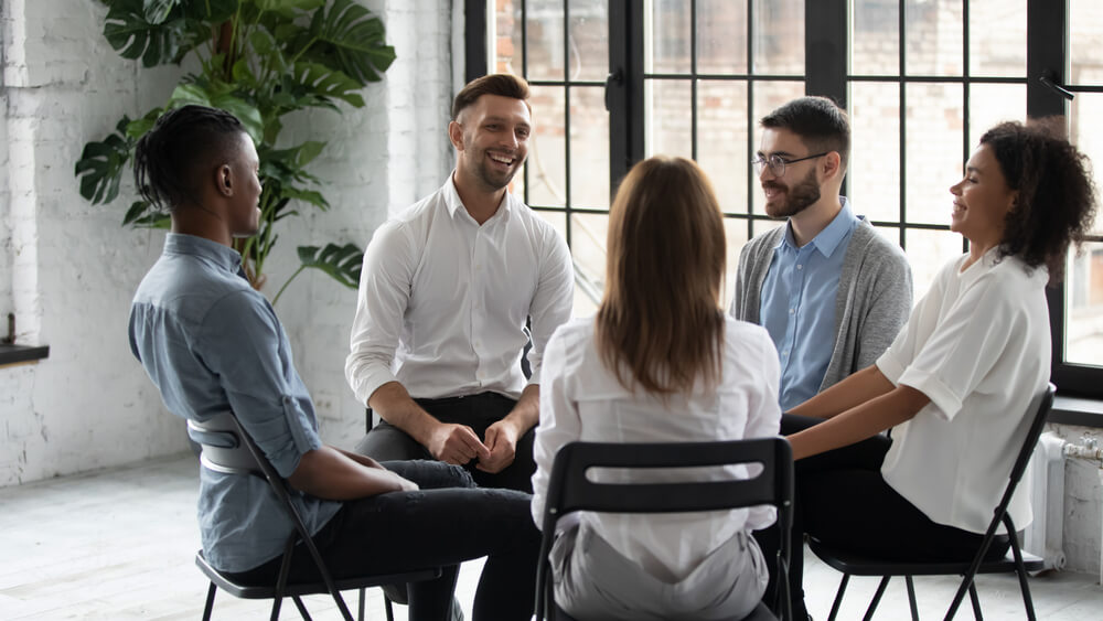 Sober Living California 2 Group of individual talking to each other in a group session
