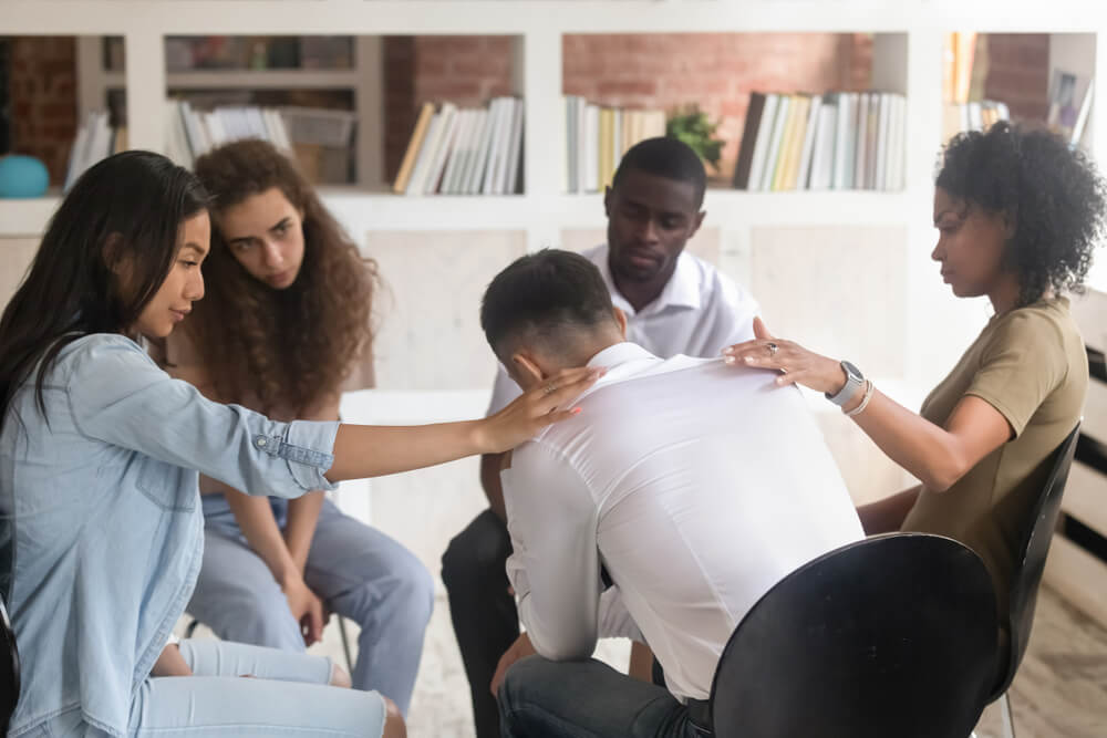 Best Drug Rehab Los Angeles 2 A troubled man consoling by his fellow patients