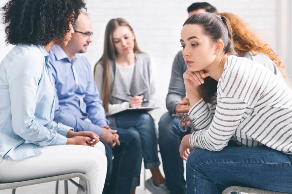 Best Drug Rehab Los Angeles 1 A young woman listening while in a group session
