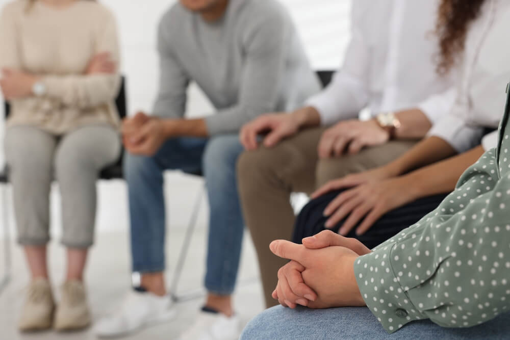 Sober Living California 1 everyone is listening while in a group session in rehab center