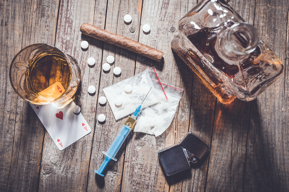 What Is a Speedball Drug? Dangers You Should Know 2 alcohol and illegal drugs on the floor
