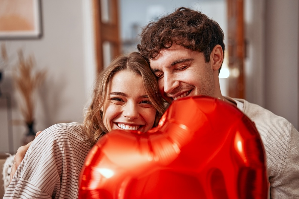Why Love in Sobriety Is Better 2 Husband and wife celebrating sobriety holding a red balloon
