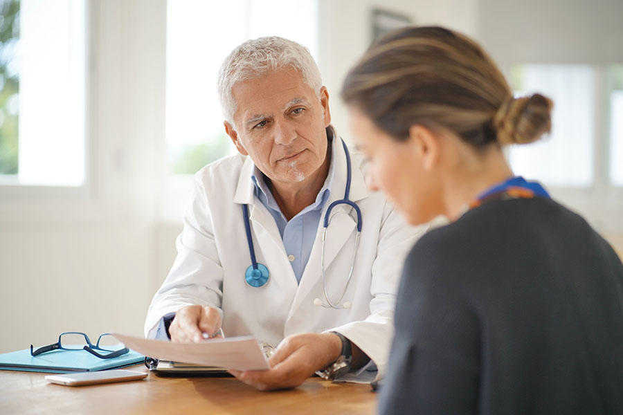 Blue Cross Blue Shield Insurance Coverage for Addiction Treatment Services 2 Caring clinician at Safe Haven Recovery providing compassionate support to a patient during addiction treatment emphasizing affordable quality care with Blue Cross Blue Shield coverage