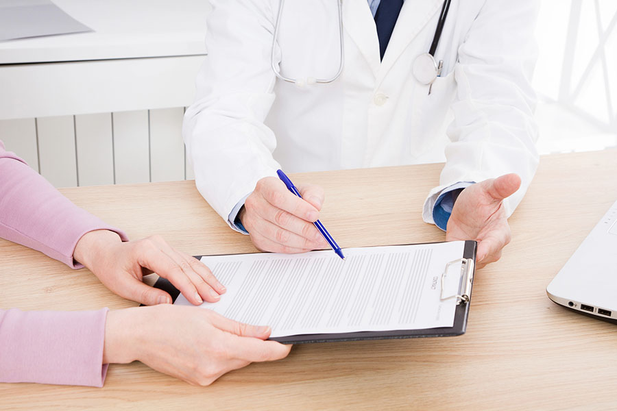 Alcohol and Drug Rehab That Accepts Aetna Insurance 1 Patient and compassionate healthcare professional at Safe Haven Recovery reviewing Aetna insurance coverage details for alcohol and drug rehab, ensuring accessible addiction treatment