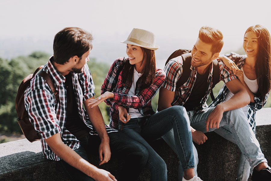 Group of friends laughing outdoors, symbolizing life after overcoming struggles from opioid addiction