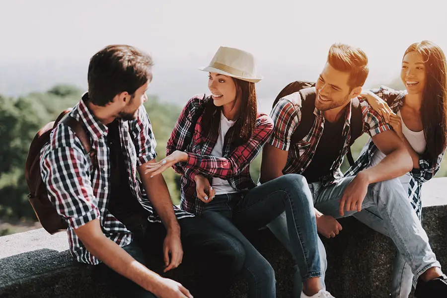 group of friends laughing outdoors, symbolizing life after overcoming struggles from opioid addiction