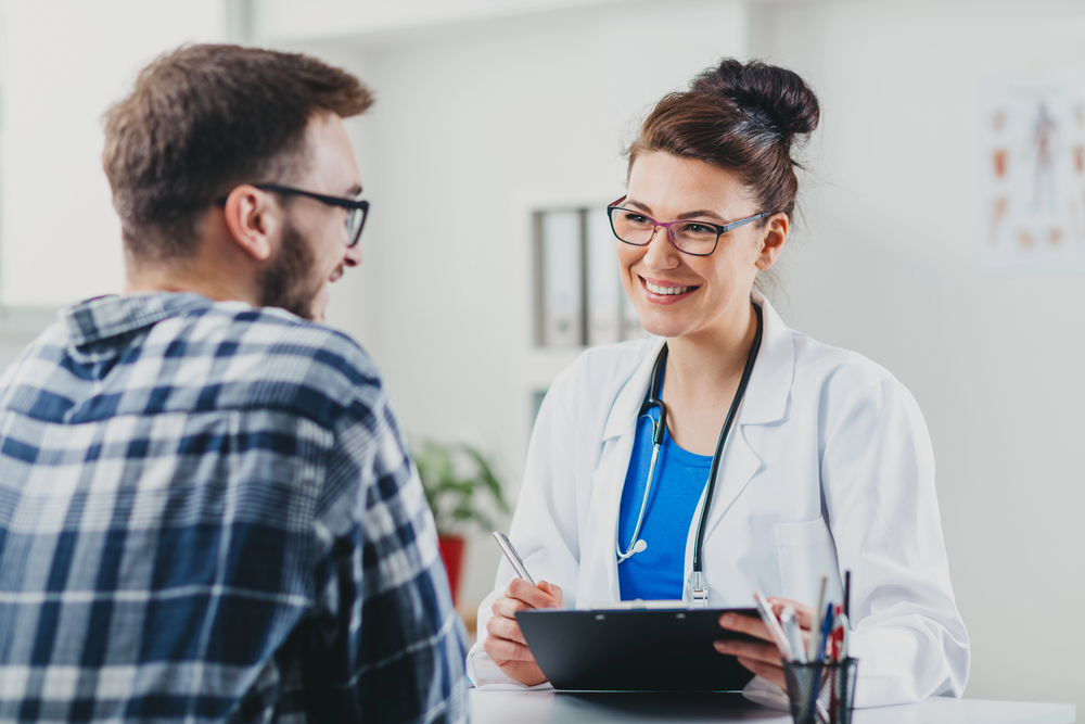 Doctor talks to patient about addiction and mental health.