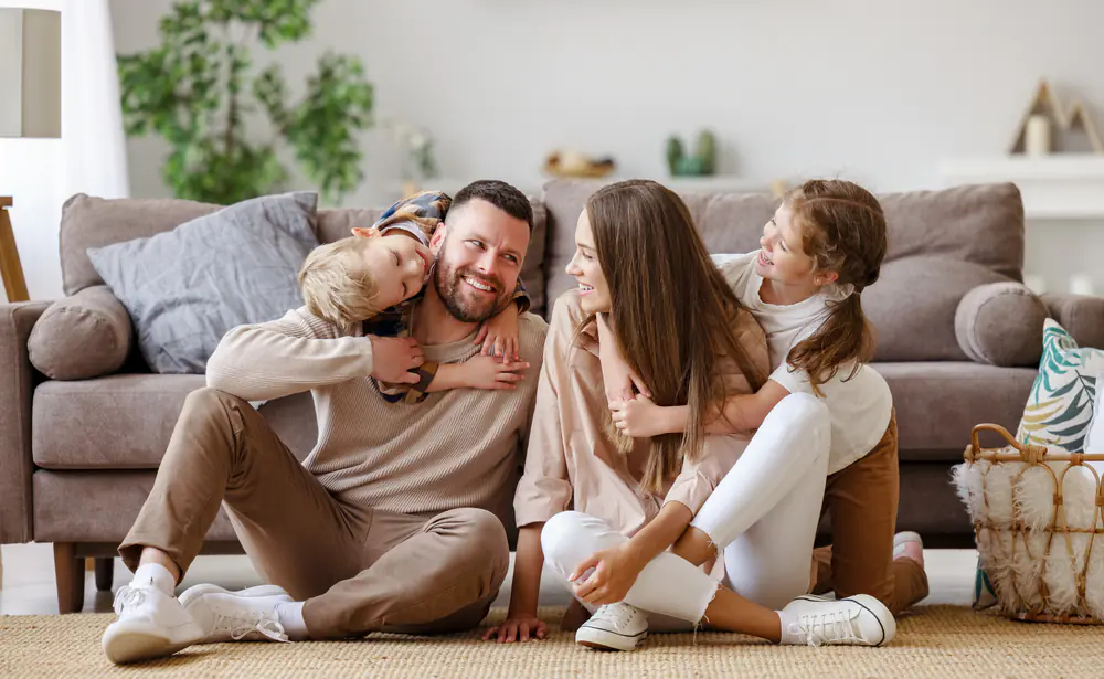 happy family at home on floor, image representing life free from meth addiction.