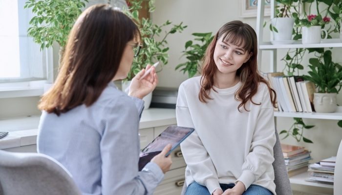 a female patient with addiction problem at a therapy session in a luxury drug rehab