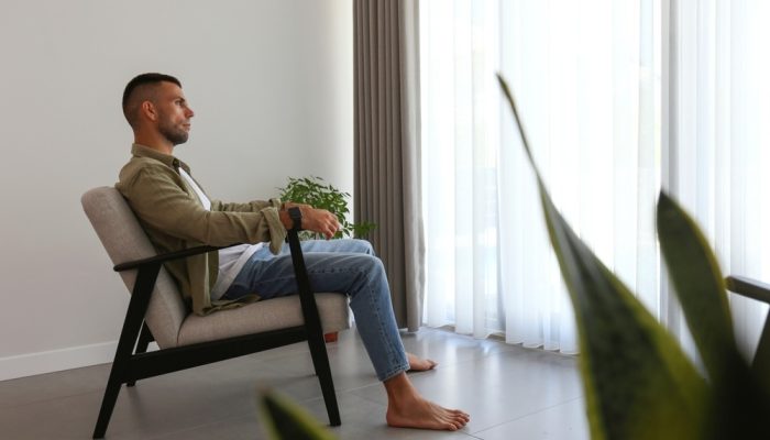 Is a Luxury Rehab Worth It? A man alone in a room at luxury drug rehab